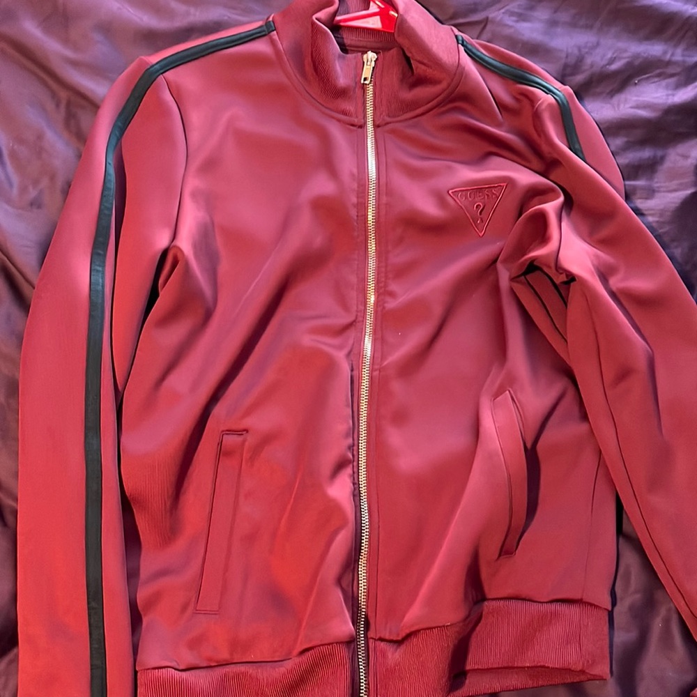 Burgundy color with black lining barely worn